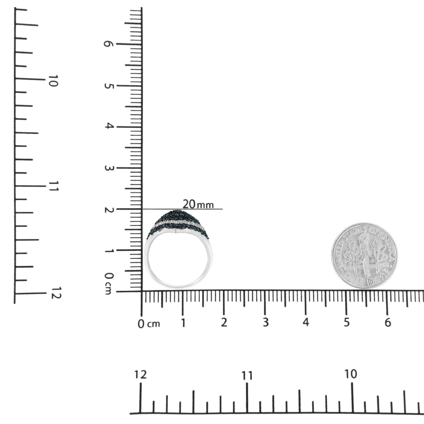 Top view of a white metal ring with multiple rows of blue and white round prong-set gemstones, placed on a ruler and scale for size reference.