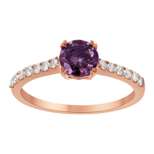 Front angle view of a rose metal ring with a round purple gemstone center and round white gemstones along the band.