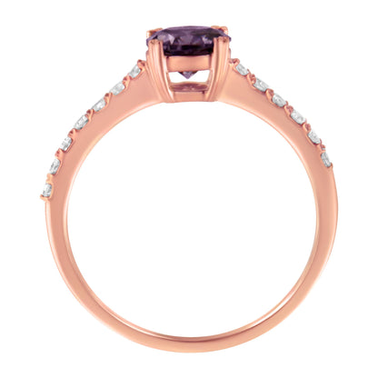 Side view of a rose-colored ring featuring a round purple gemstone in prong setting at the center and round white gemstones in prong settings along the band.