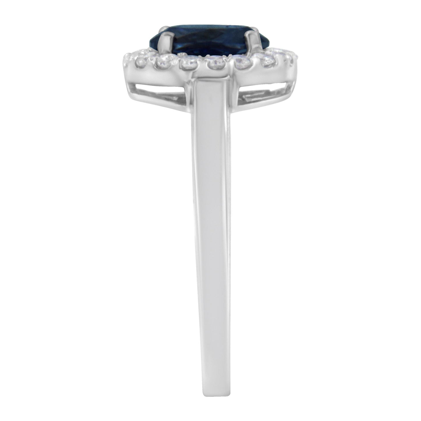 Side view of a white ring featuring a central oval blue gemstone surrounded by a halo of small round white gemstones in prong settings.