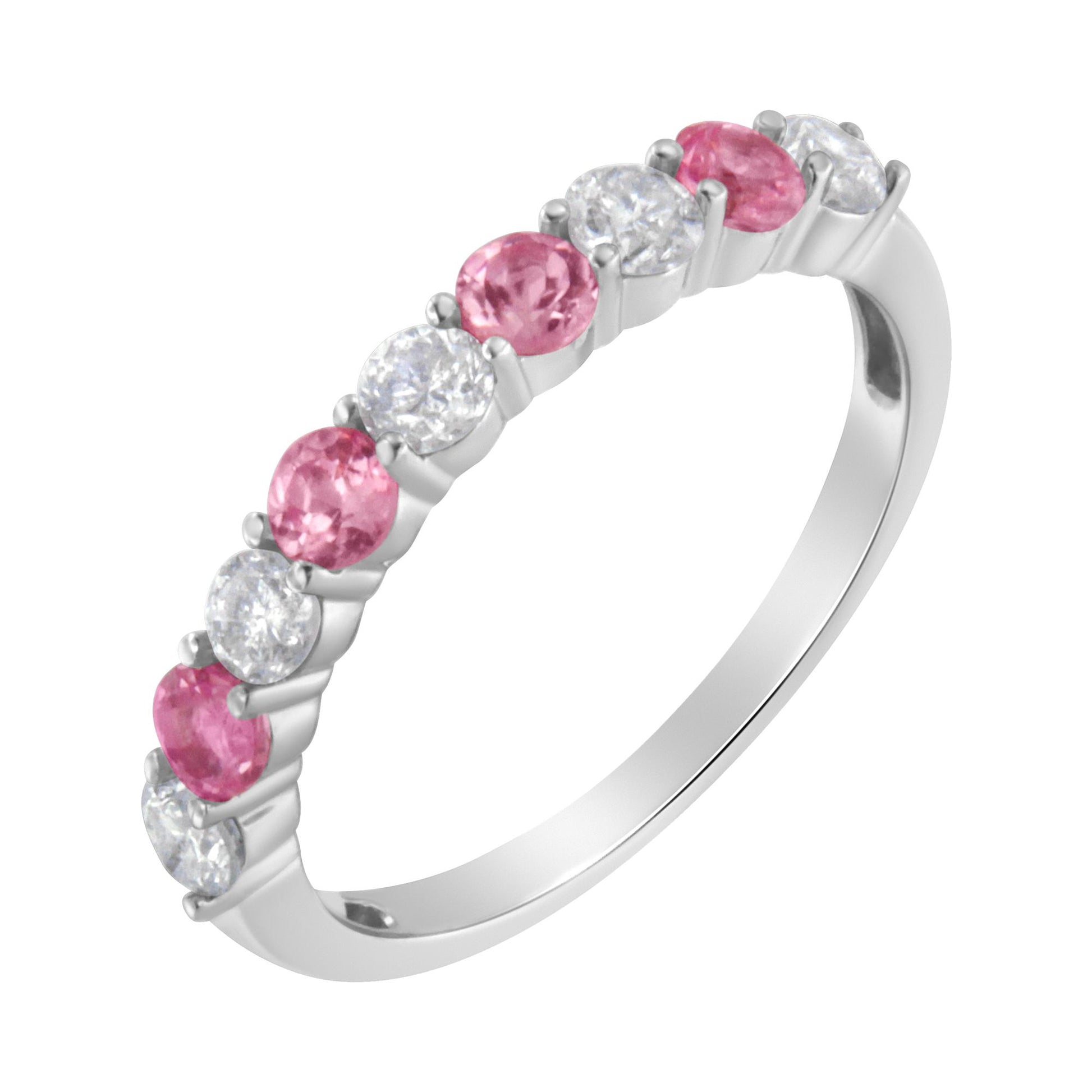 White metal ring with alternating round white and pink gemstones in prong settings, shown at an angled side view.