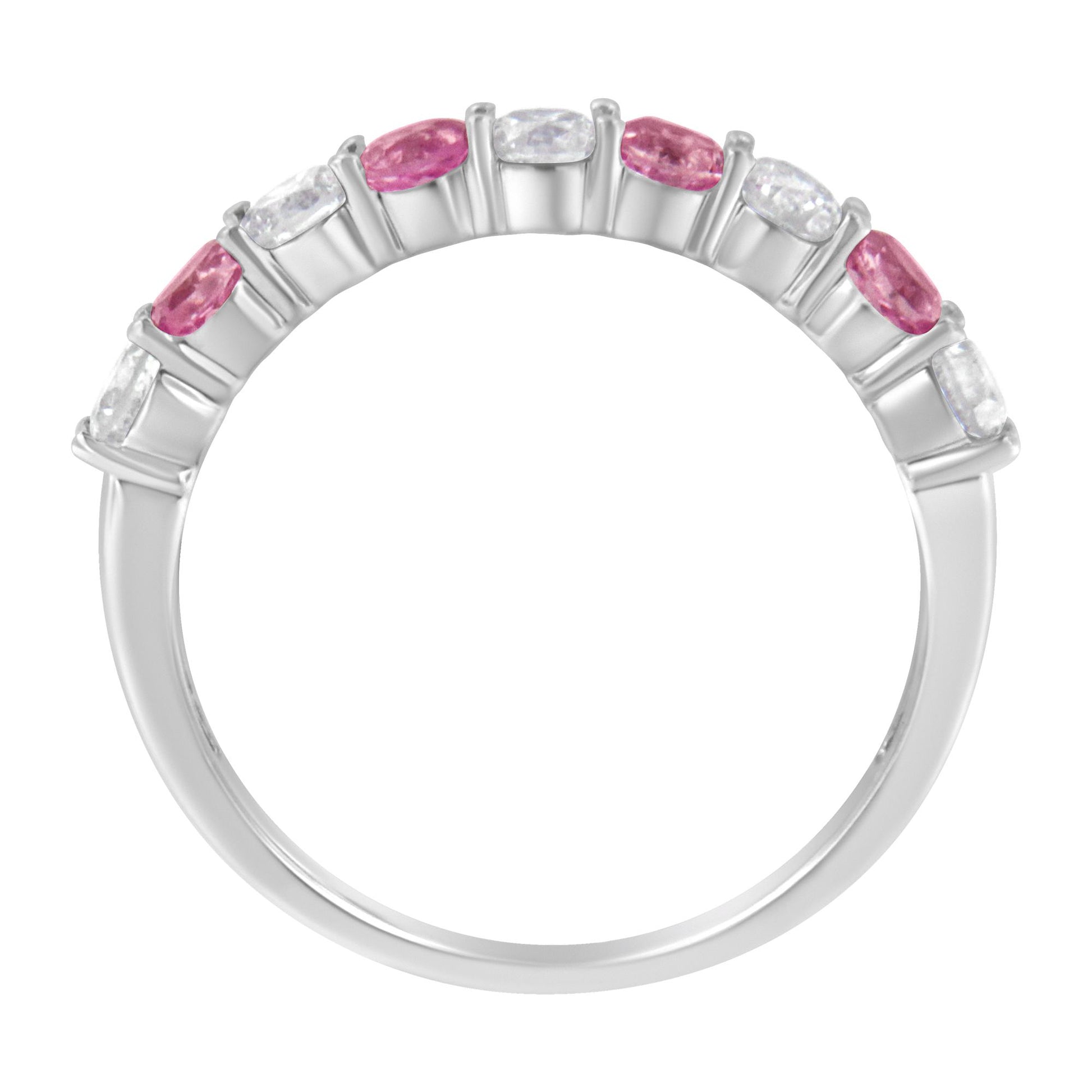 White metal ring with alternating round white gemstones and pink gemstones in prong settings, shown from a front angle.