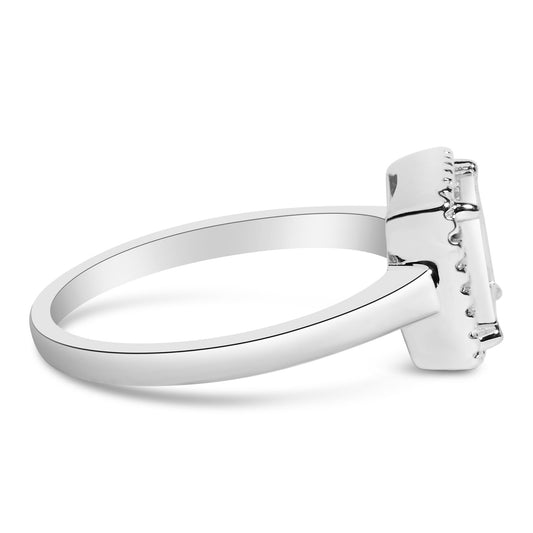 Side angle view of a white metal ring with a rectangular cluster of princess-shaped white gemstones in an invisible setting.