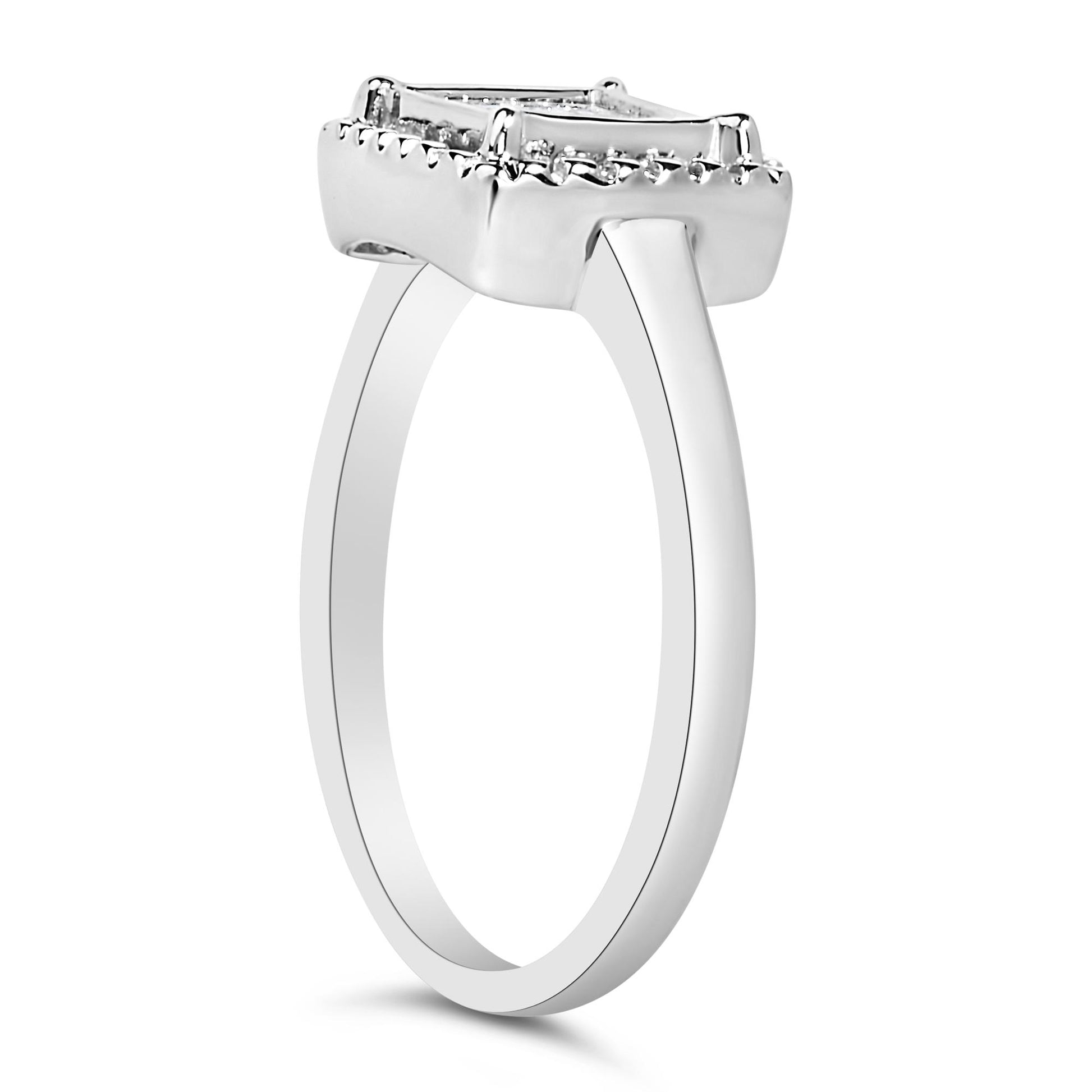 Side angle view of a white ring with a rectangular top featuring multiple princess shaped white gemstones in an invisible setting.
