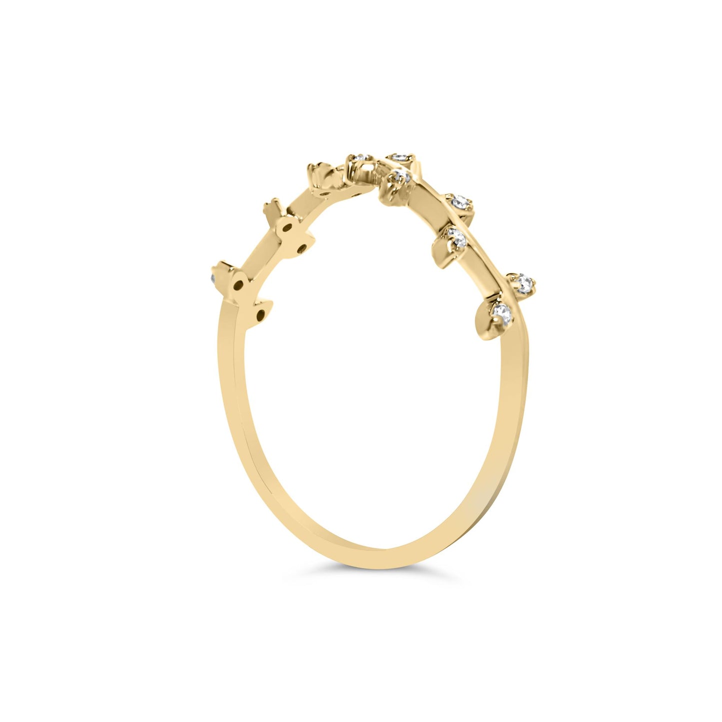 Yellow metal ring with multiple small white round gemstones in prong settings, shown from a side angle.