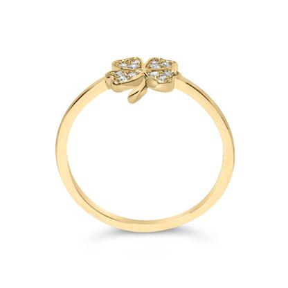 Front-facing view of a yellow metal ring with a four-leaf clover design on top, each leaf set with multiple round white gemstones in prong settings.