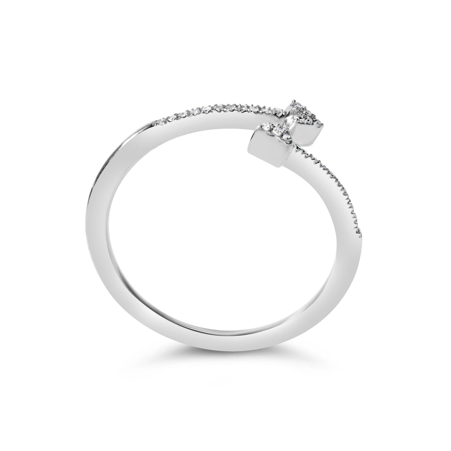 White metal ring with an open design, featuring round white gemstones in prong settings along the band, shown from a side angle on a white background.