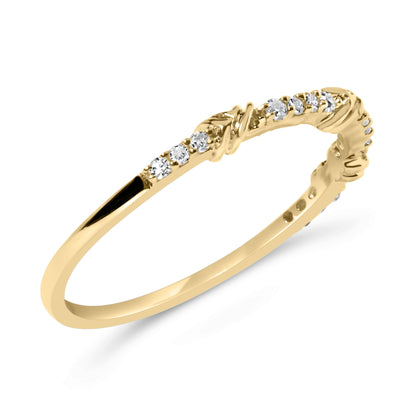 Yellow metal ring with a delicate band featuring round white gemstones in prong settings, shown at a slight angle.