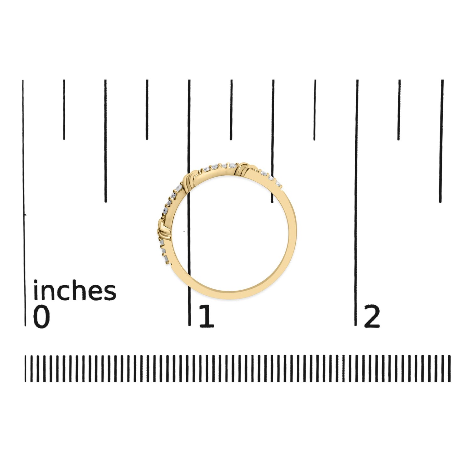 Yellow metal ring with round white gemstones in prong settings, shown flat on a scale from a top-down angle.
