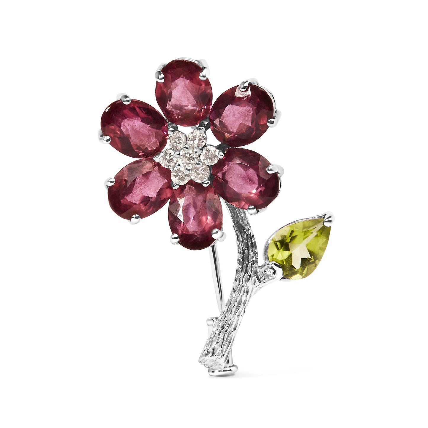Close-up front angle of a white metal flower-shaped brooch with oval pink gemstones as petals, round white gemstones clustered in the center, and a pear-shaped green gemstone as a leaf on a textured stem.