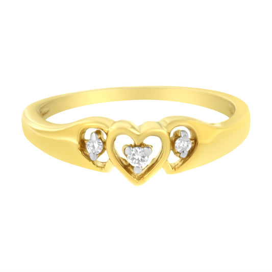 Front-facing yellow ring with three hearts, each holding a round white gemstone in prong settings, photographed at close-up angle.