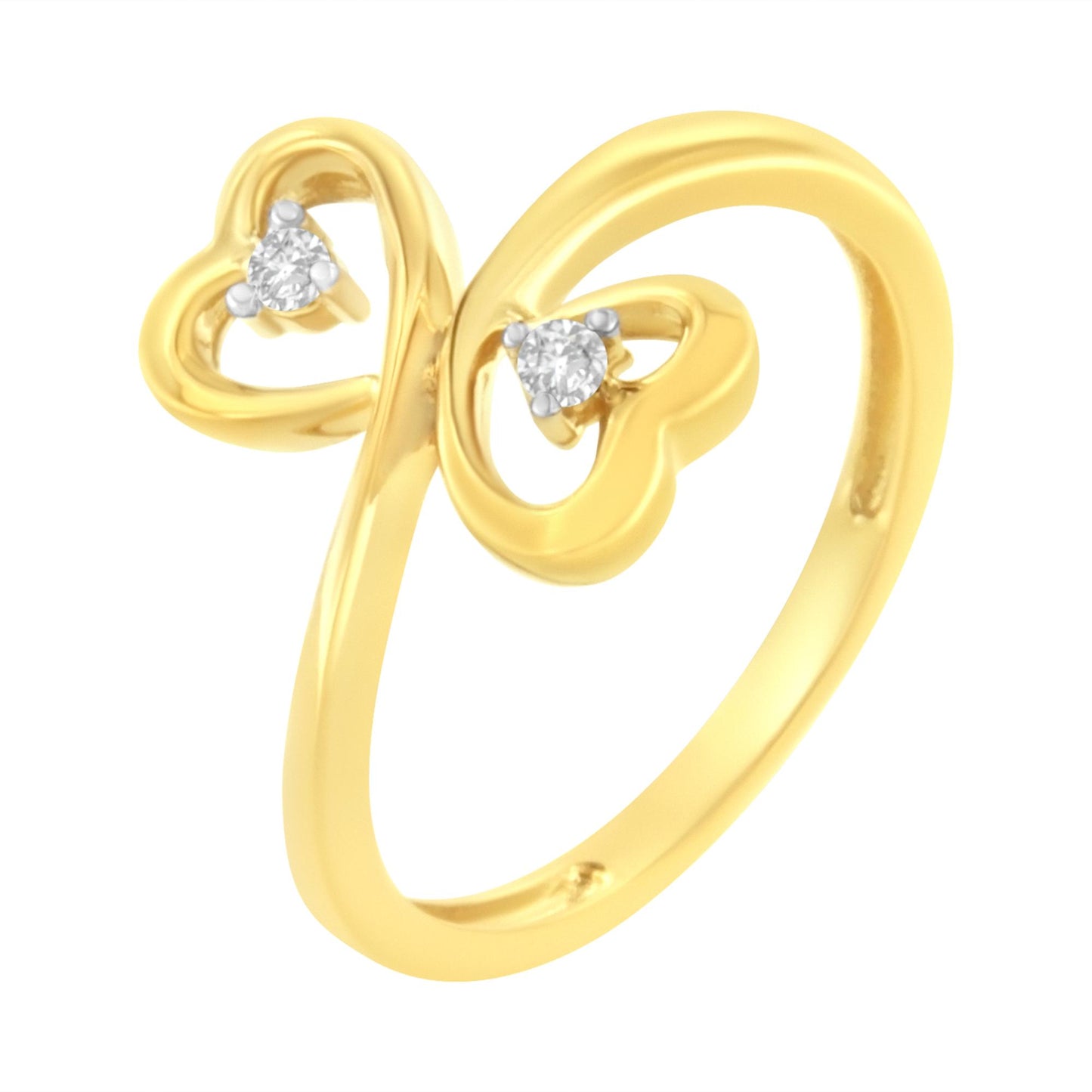 Yellow metal ring with two heart shapes open at the top, each set with a round prong-set white gemstone, shown from a slightly angled front view.