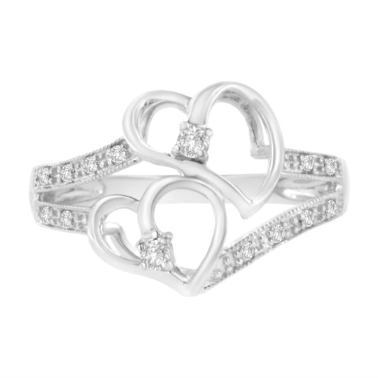 Front angle of white ring with two open heart shapes each holding a prong-set brownish round gemstone, with micro-pave set brownish round gemstones along the split band.