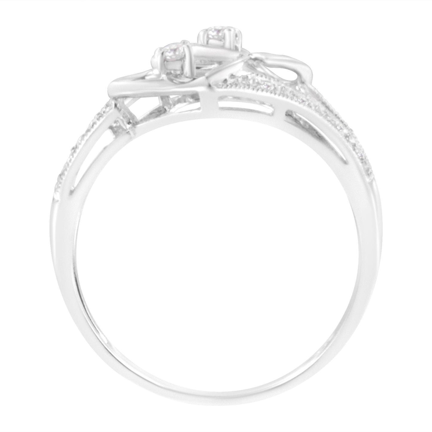Side view of a white ring featuring round brownish gemstones in micro-pave and prong settings along the band and top.