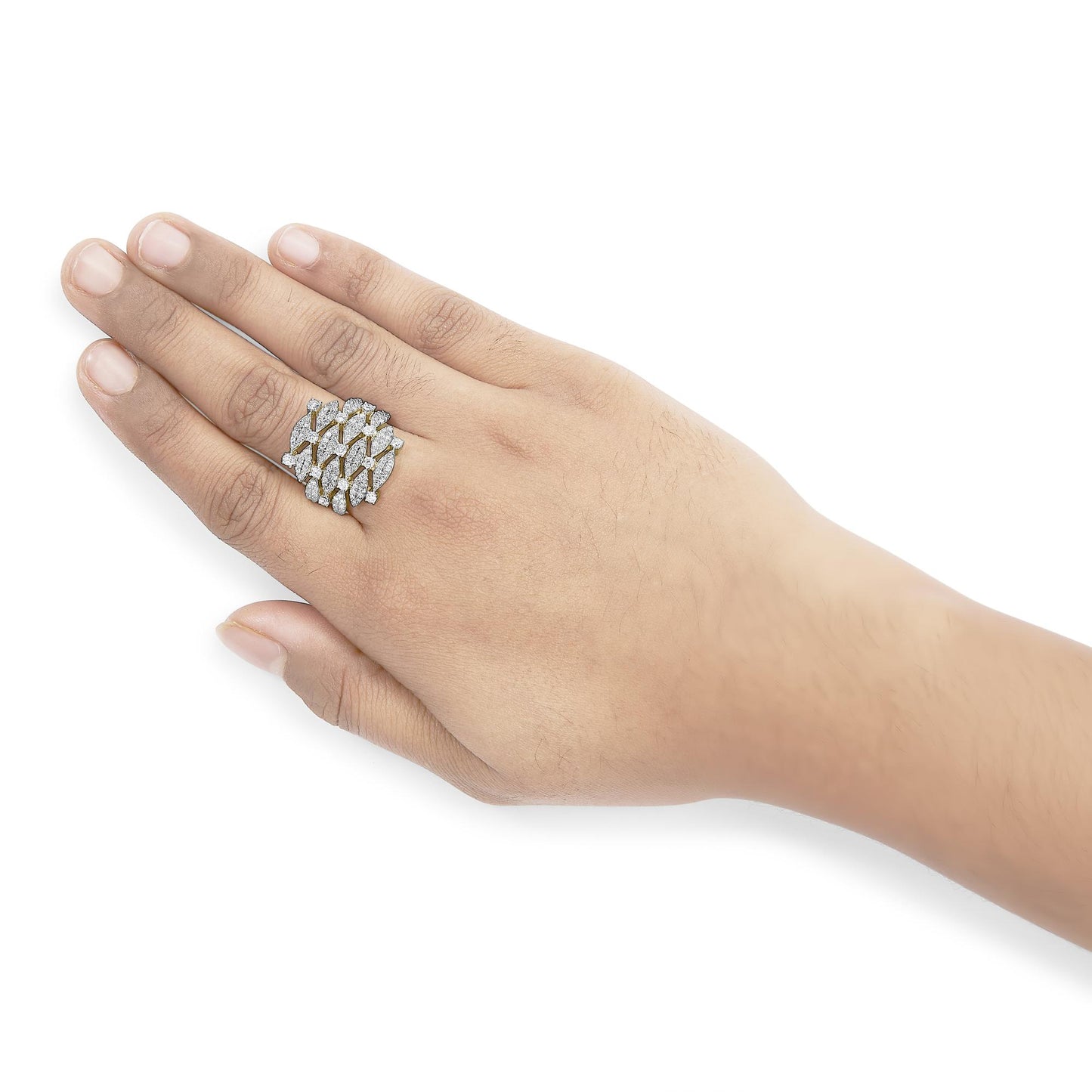 Yellow metal ring with multiple rows of round white gemstones in prong settings, worn on a hand shown from top angle.
