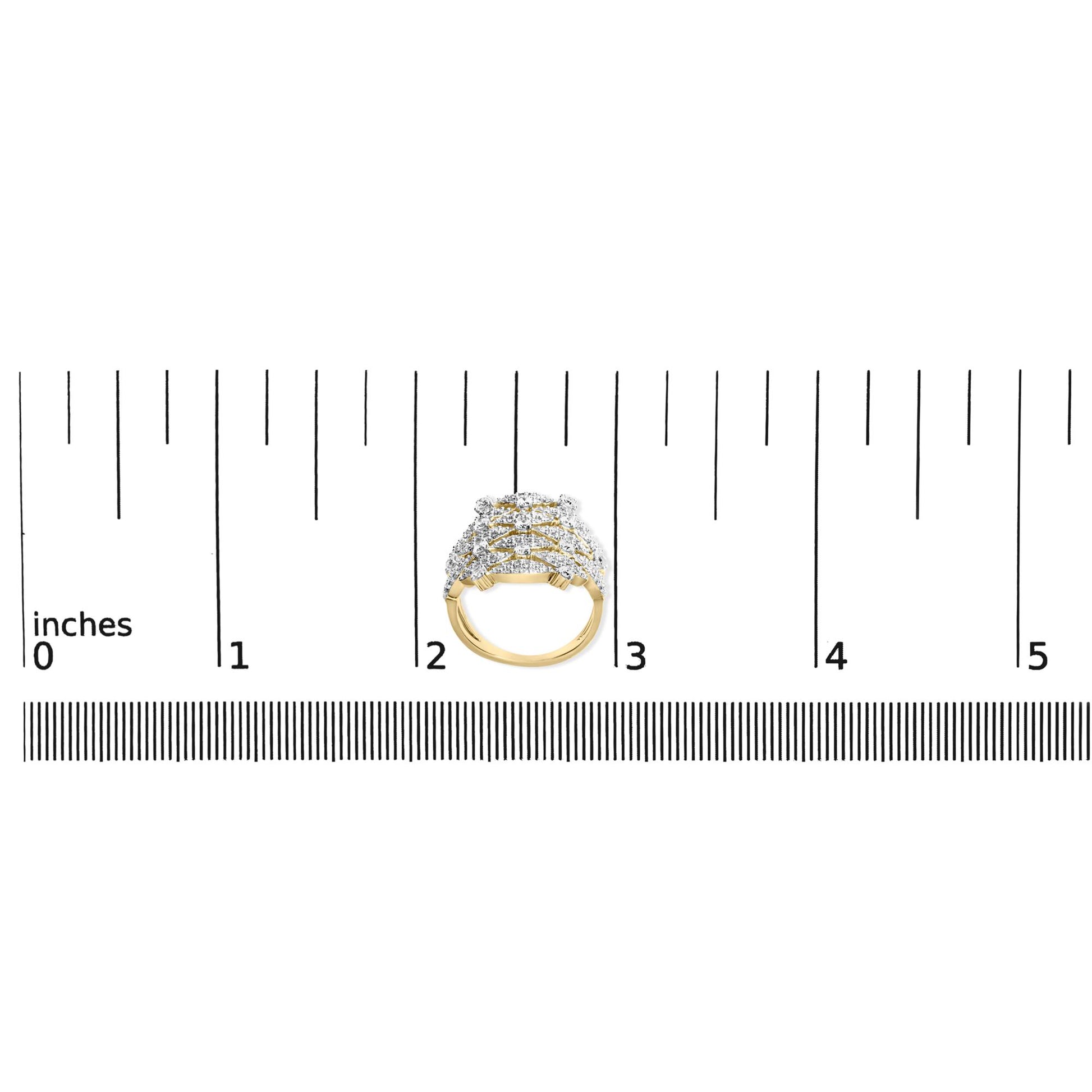 Top-down view of a yellow metal ring with multiple rows of white round prong-set gemstones, displayed on a ruler for size reference.