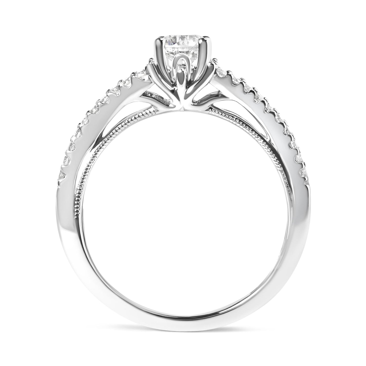 Side view of a white metal ring with a round white gemstone in a four-prong setting at the center and multiple smaller round white gemstones in a shared prong setting along the band.