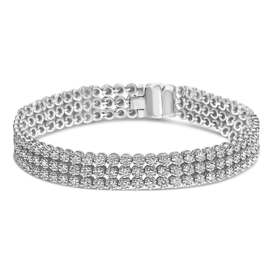 White metal bracelet with three rows of round white gemstones in prong settings, shown from a front angle.