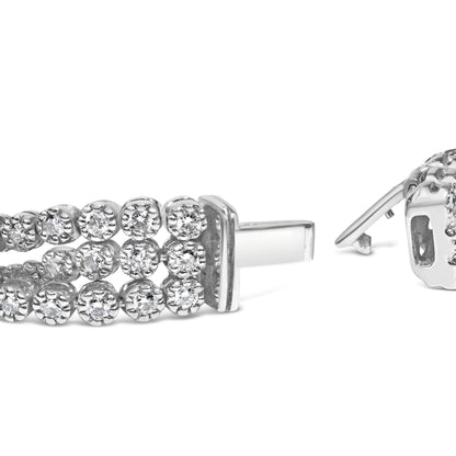 Close-up side view of a white metal bracelet with two rows of round white gemstones in prong settings and a clasp open.