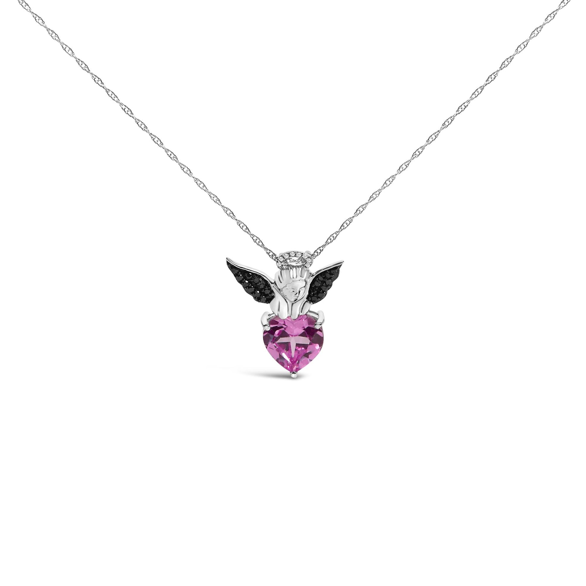 Front view of a white and black metal necklace pendant featuring an angel holding a heart-shaped pink gemstone, with black round gemstones on the wings and white round gemstones as a halo.