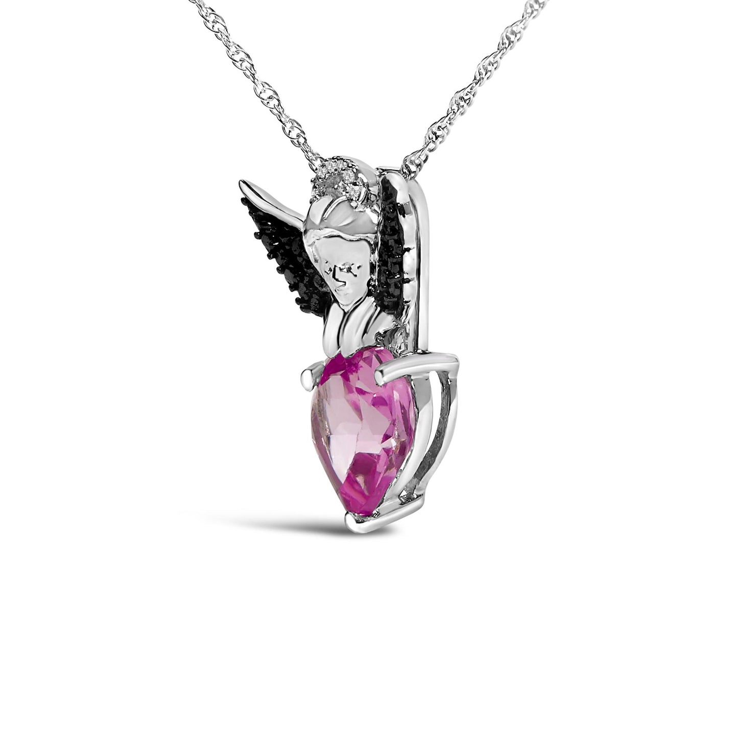 Close-up front angle of a white and black metal necklace pendant shaped like an angel, featuring black round gemstones on the wings, white round gemstones near the head, and a pink heart-shaped gemstone held by the angel.