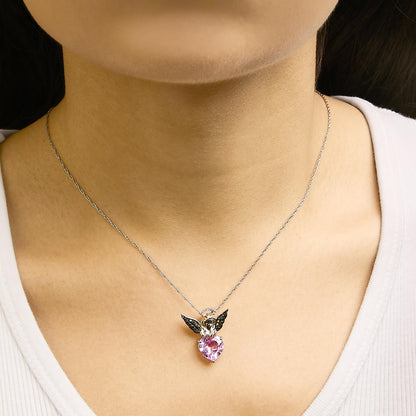 Necklace with a heart-shaped pink gemstone pendant accented by small white and black round gemstones, shown worn on a model from a front angle.