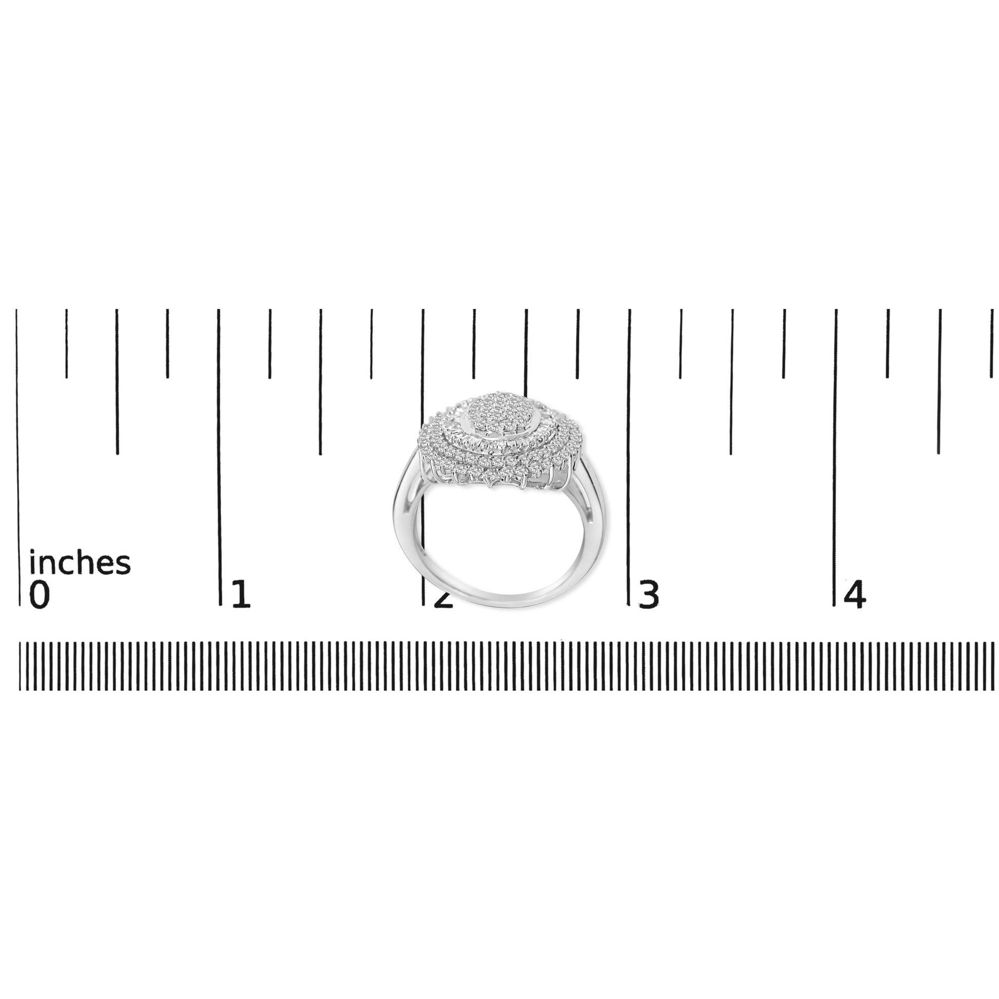 Ring shown on a scale, top-down angle, featuring a white metal band with round white gemstones in prong settings and baguette white gemstones in channel settings.