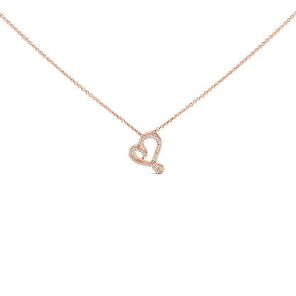 Close-up front view of a rose-colored necklace with a heart-shaped pendant outlined with round white gemstones in bezel settings.