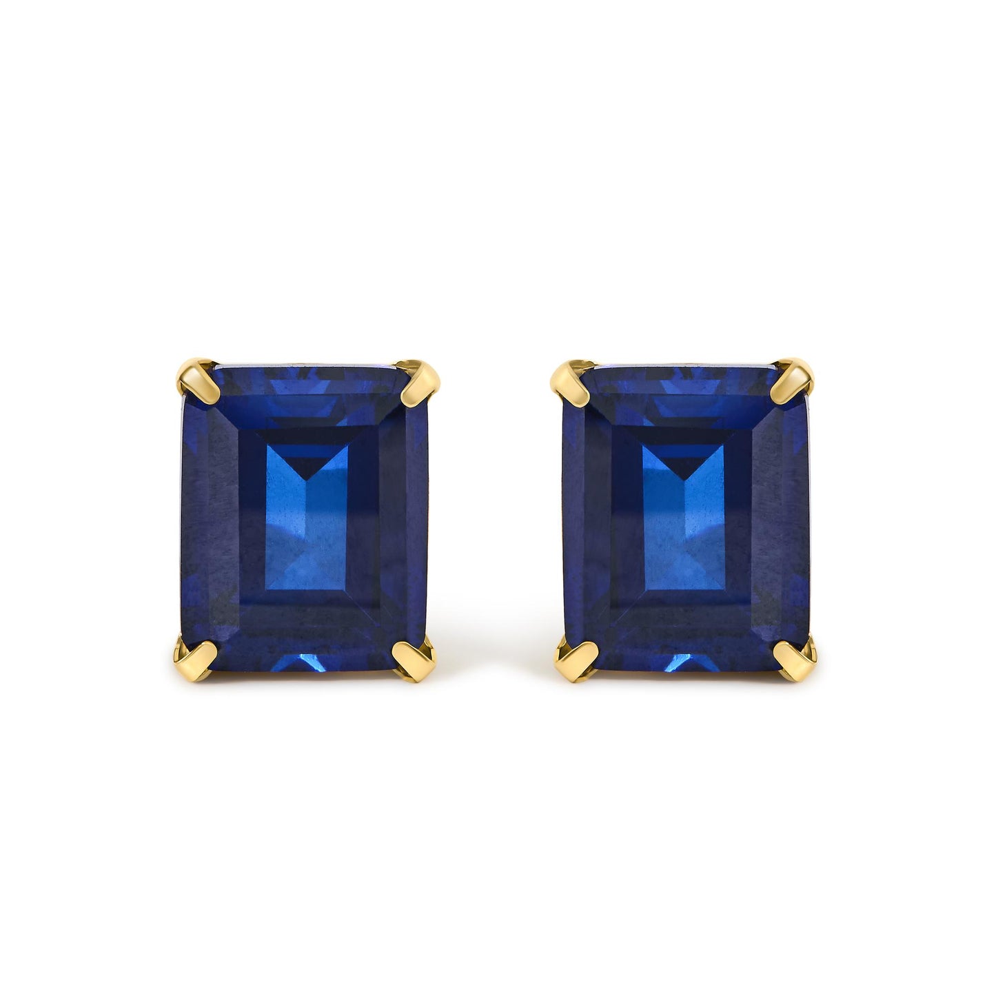 Close-up front view of a pair of yellow metal earrings featuring large rectangular blue gemstones in four-prong settings.