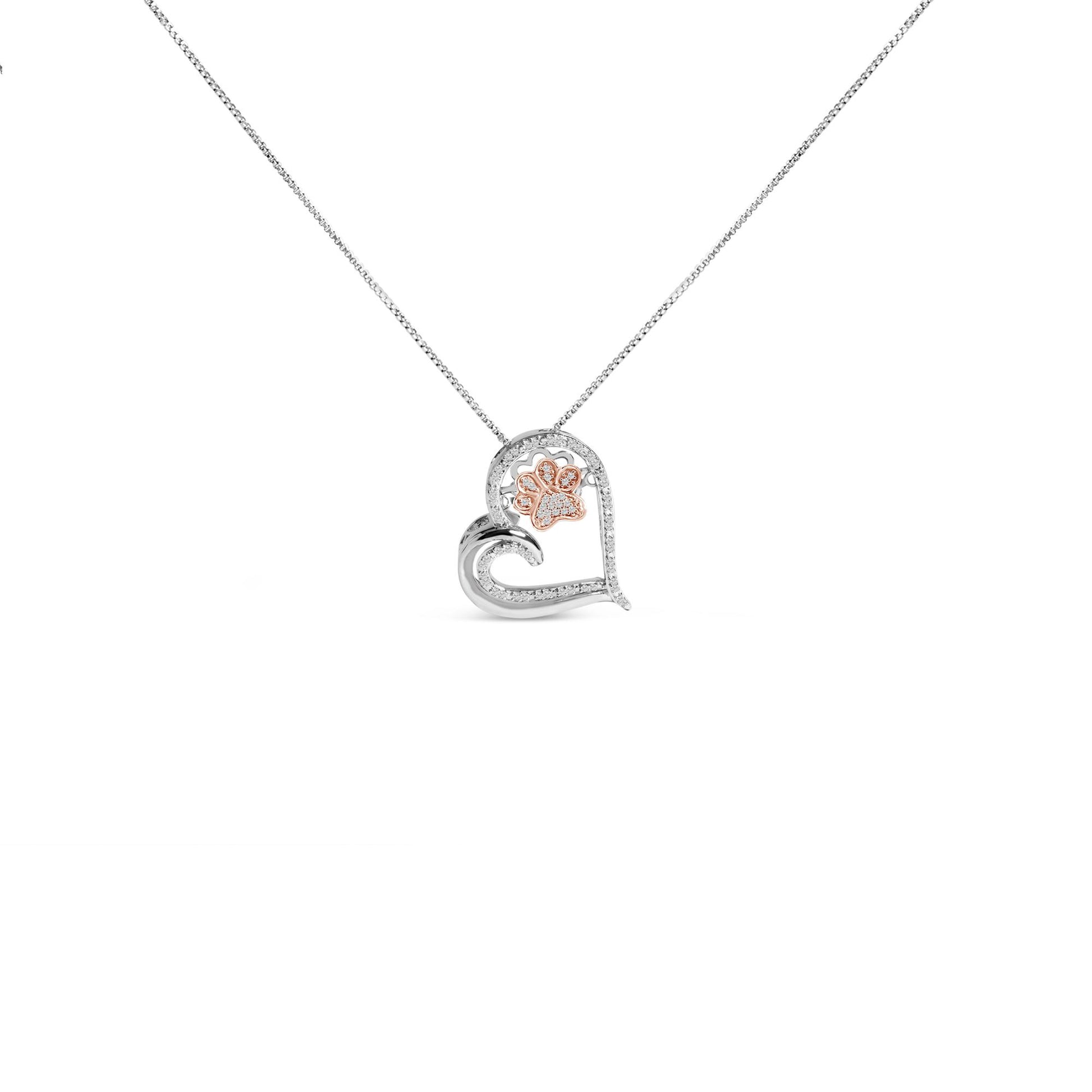 Front view of a white and rose metal heart-shaped necklace pendant with a paw print design. The pendant features white round gemstones in prong settings along the heart outline and inside the paw print.