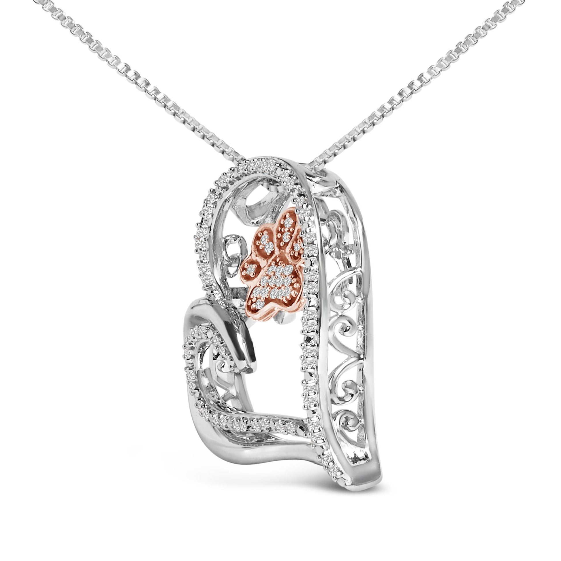 Close-up front angle of a two-tone heart-shaped necklace pendant with a rose-colored paw print accented with small white gemstones and surrounded by white metal with white gemstones, shown on a chain.