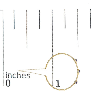 Yellow bracelet with textured and smooth sections, featuring oval purple gemstones and round white gemstones in prong settings, shown flat on a measurement scale from a top-down angle.