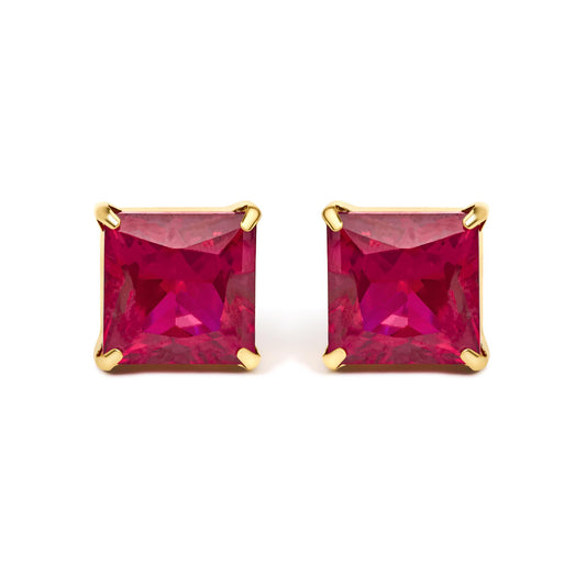 Close-up front view of yellow metal earrings featuring red princess-shaped gemstones in four-prong settings.
