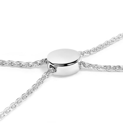 Close-up top angle of a white braided chain bracelet with a smooth, round sliding clasp.
