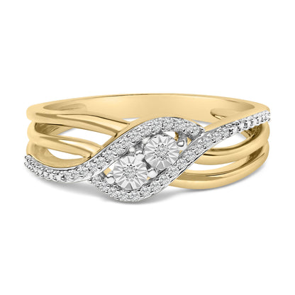 Close-up front angle of a ring with yellow and white metal bands featuring two larger round white gemstones surrounded by smaller round white gemstones in a prong setting.