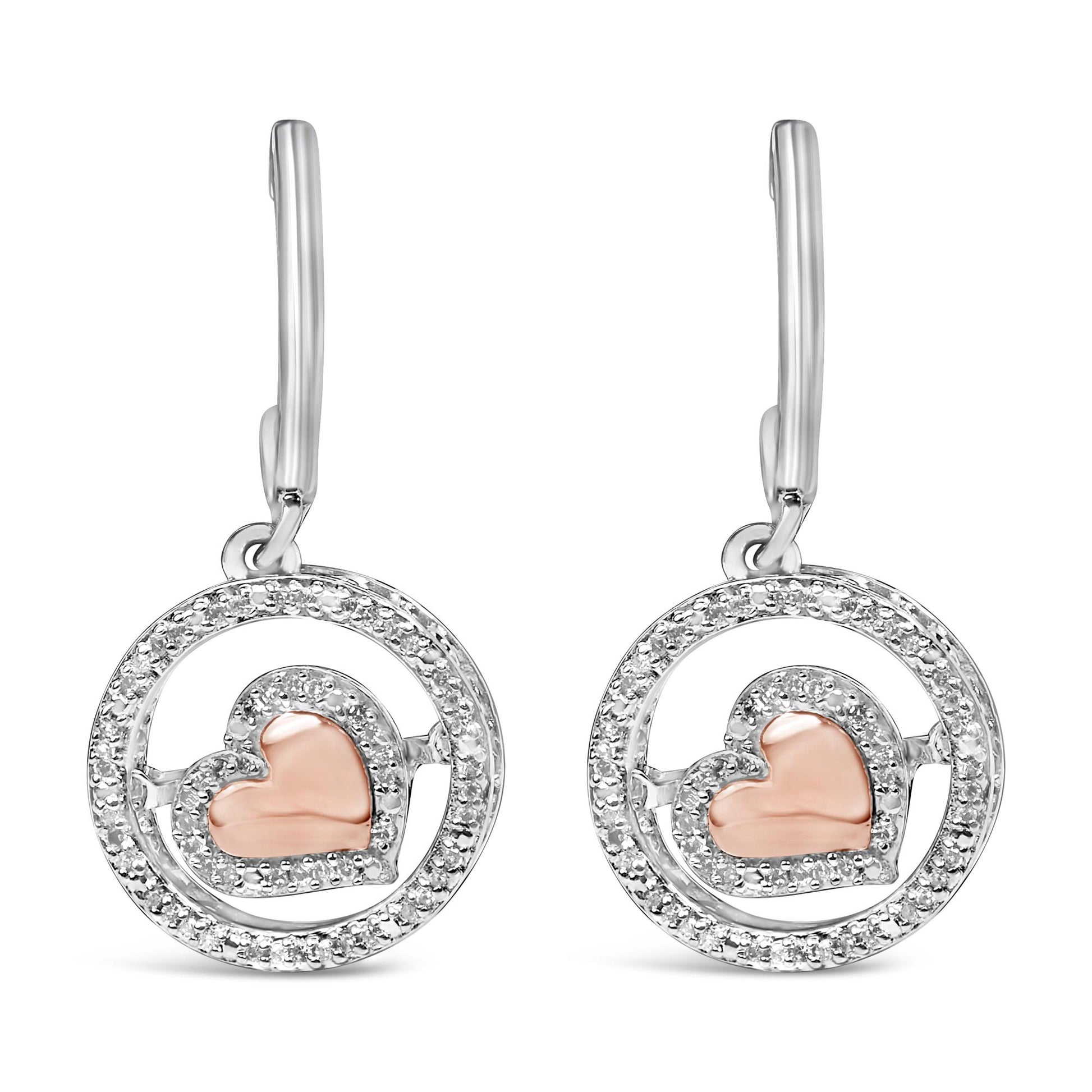 Front view of a pair of earrings featuring a circular design with white gemstones outlining the circle and a rose-colored heart shape accented with white gemstones inside each circle, shown against a white background.