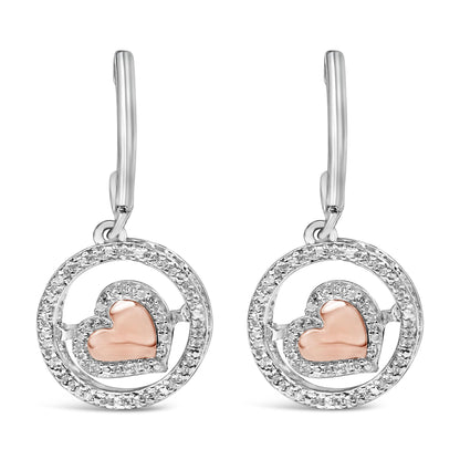 Front view of a pair of earrings featuring a circular design with white gemstones outlining the circle and a rose-colored heart shape accented with white gemstones inside each circle, shown against a white background.