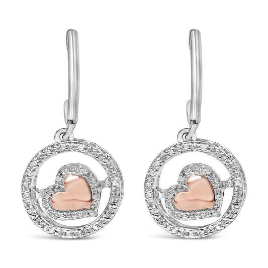 Front view of a pair of earrings featuring a circular design with white gemstones outlining the circle and a rose-colored heart shape accented with white gemstones inside each circle, shown against a white background.