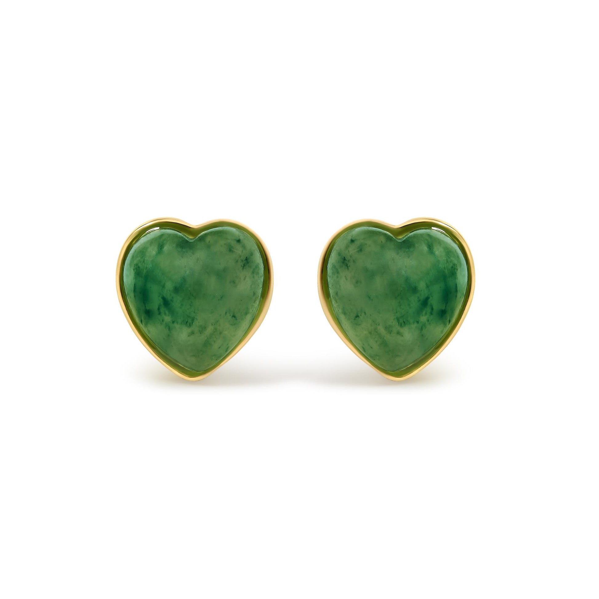 Close-up front view of yellow metal heart-shaped earrings featuring green heart-shaped gemstones in bezel settings.