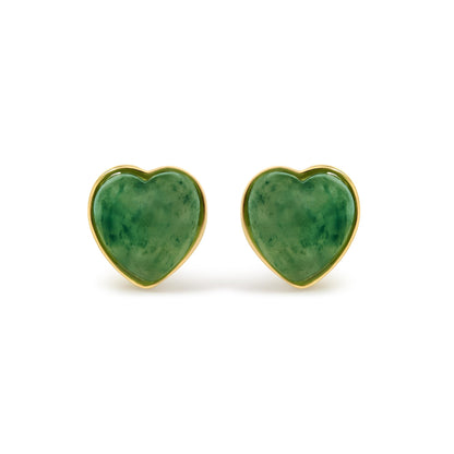 Close-up front view of yellow metal heart-shaped earrings featuring green heart-shaped gemstones in bezel settings.
