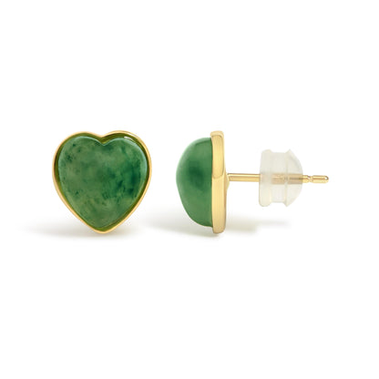 Close-up side and front angle of yellow metal heart-shaped earrings with green heart-shaped gemstones in bezel setting, shown on a white background.