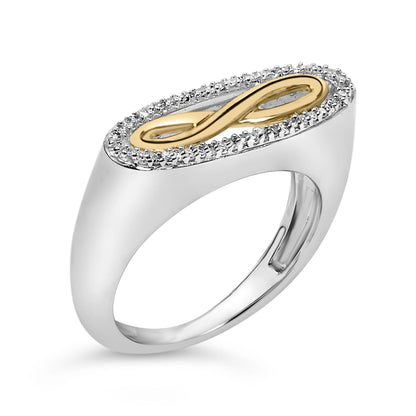 Close-up angled view of a ring with a white metal band. The top features an oval-shaped design with a yellow metal infinity symbol in the center, surrounded by a border of small white gemstones in a shared prong setting.