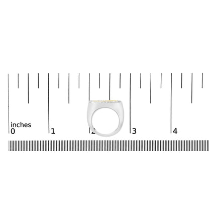 Ring with yellow and white metal featuring round white gemstones in shared prong setting, shown on a scale from side angle.