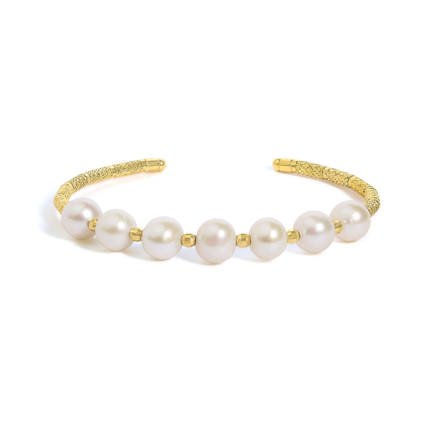 Close-up front angle of a yellow metal bracelet with textured ends and large white gemstones, partially visible on a white background.