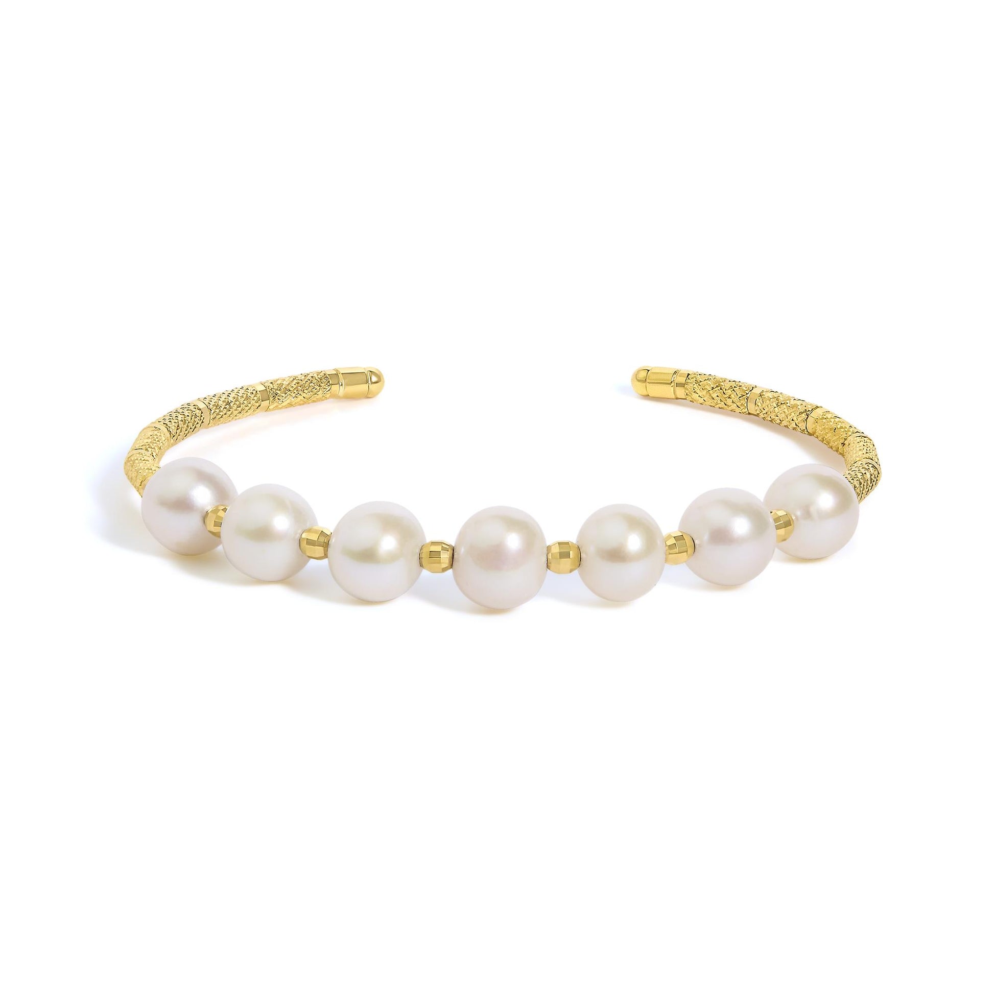 Close-up front angle of a yellow metal bracelet with textured ends and large white gemstones, partially visible on a white background.