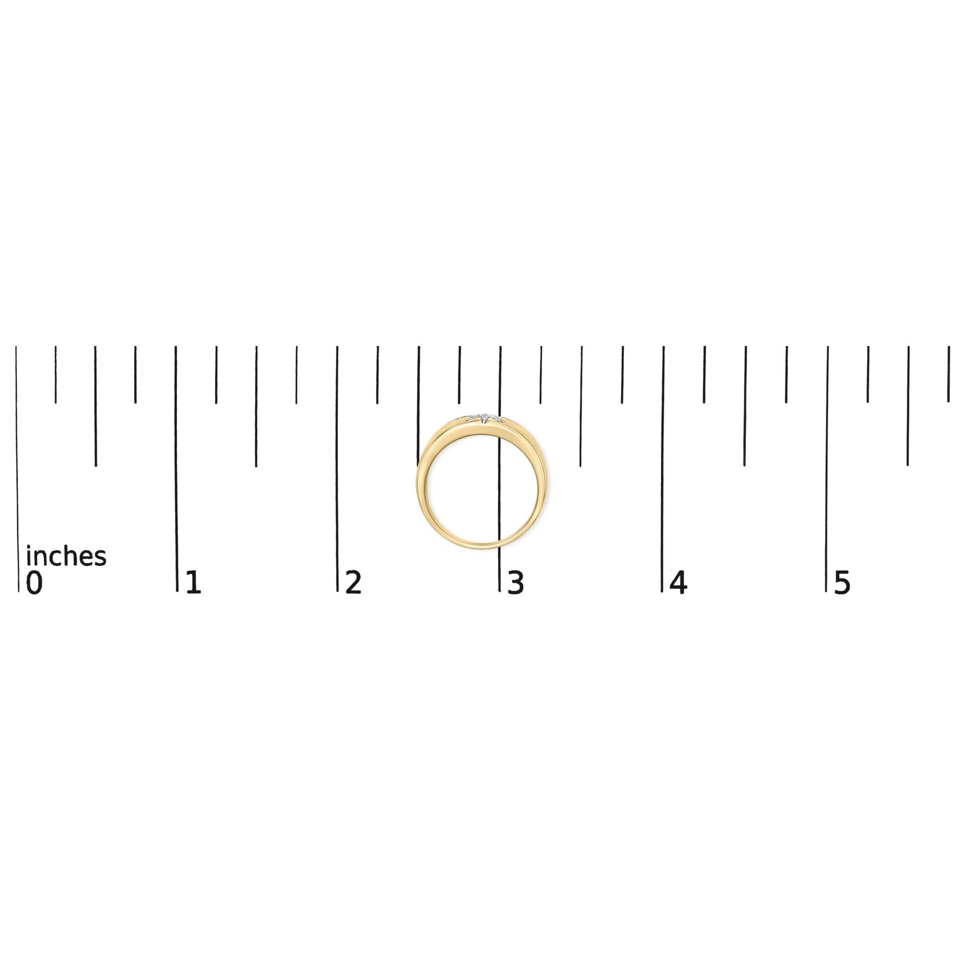 Yellow metal ring with two rows of small round white gemstones in prong settings, shown from the top on a ruler scale.