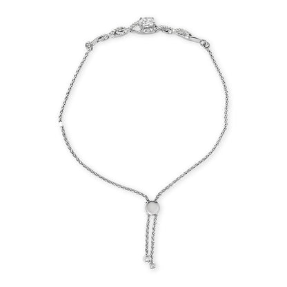 White metal bracelet with a round adjustable slider and delicate chain, featuring a larger central white gemstone and smaller white gemstones along the top section, shown from a top-down angle on a white background.