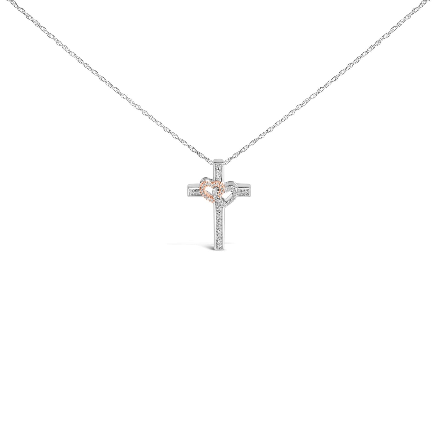 Front view of a necklace with a cross pendant featuring two connected hearts; one heart is outlined in rose color and the other in white, both adorned with small white gemstones in a pave setting.