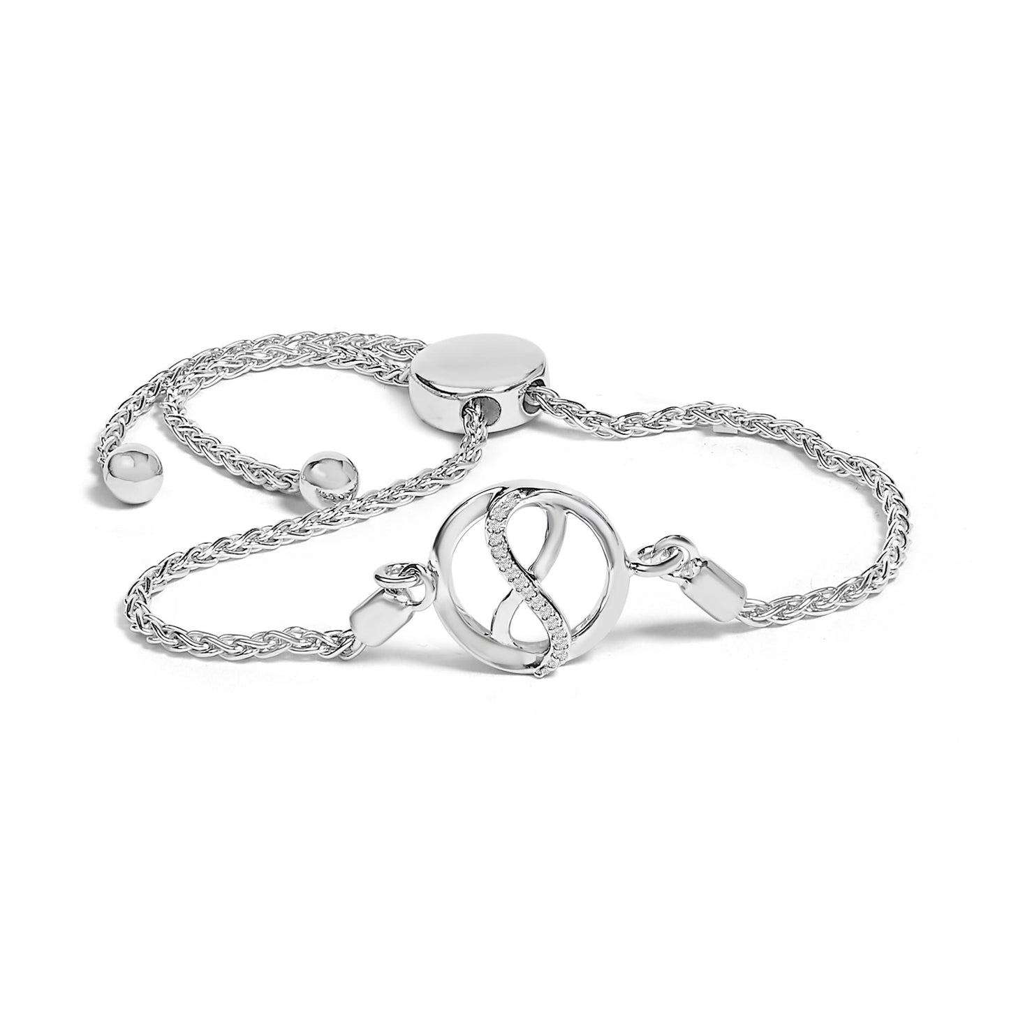 White metal bracelet with a circular centerpiece featuring an infinity design accented with round white gemstones in prong settings, shown in a close-up angled shot.
