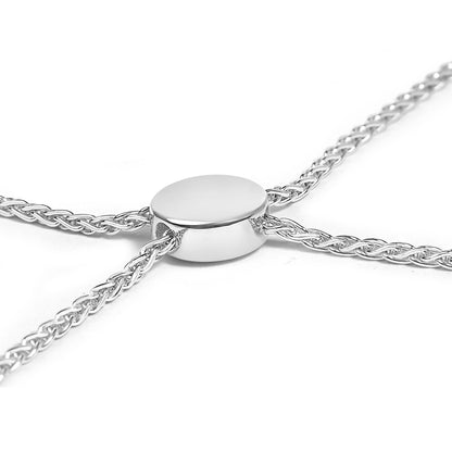Close-up front angle image of a white metal bracelet with a smooth oval centerpiece and braided chain strands.